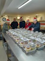 Volunteers pack the lunches for delivery