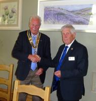 Ron Smith welcomes Iain Smith as the new President of Hawick Rotary