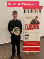 Dylan Wallace with his trophy as Scottish Rotary Young Vocalist