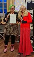 Verity, South Molton Citizen of the Year, being presented with her award by the South Molton Town Mayor, Ms J Footman.