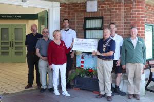 Barbara Mine from FOBs receiving the grant from Mike Barker, President Seaford Rotary watched by (from the left) Rodney Reed, Chair Seaford Rotary Community Services and FOBS members Andrew Dandridge, Michael Spence, Jim Stamford and Graham Moore 