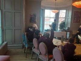 Primary pupils listen attentively to cookery demonstration