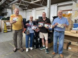 Rotarians Richard Massey, Rick Nunley and Sally Searle pose with Andy Richardson and donations from The phoenix Resource Centre