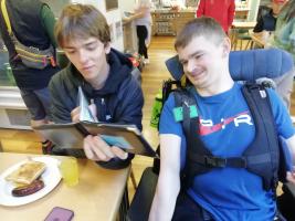 Luke shows his photo album to his newly-made friend