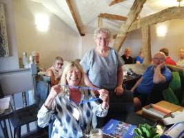 President Andrea (standing) and new member Beverley Bell
