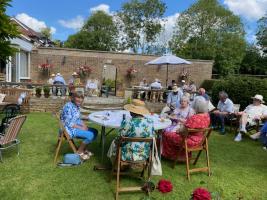 Rotary members and friends enjoying a sunny garden party 