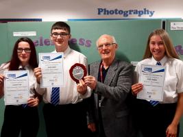 Rotarian Bob Twist with winner Jack Snaith, runner-up Holly Seddon (right), and Lauren Fair whose work was 'highly commended'.