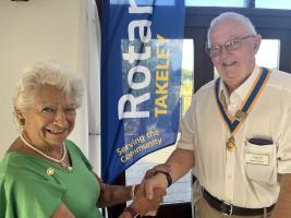 District Governor Gloria Nicholls inducts John Versey for the second year