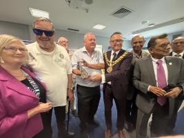 Leyland Rotary President receiving an award from the National Forum for Health  and Wellbeing for its long-standing support of the Health Mela.