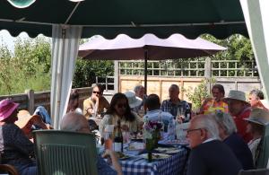 Members and their wives chatting whilst enjoying the food and drink