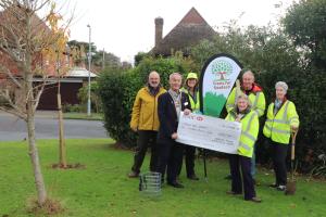 President Mike Barker presenting the grant cheque to Jean Loveland from Trees for Seaford watched by from the left Rodney Reed, Seaford Rotary Chair Community committee and Trees for Seaford members Viv Johnson, Andy Johnson and Dawn Walker