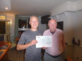 James receives a cheque for Basics Essex