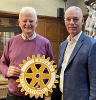 Past President and Secretary Stuart Kane welcoming our speaker on the poet Robert Service, Rotarian Jon Herd 