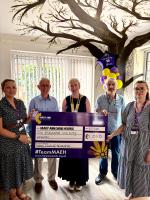 **Photo caption:**
Rotary Club members David, Sara and Geoff present a cheque for £1,050 to representatives from Mary Ann Evans Hospice. The donation forms part of the Club’s Centenary Charity Programme