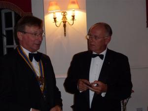 Stephen Walls receives the President's jewel form ougoing President Phil Tanner
