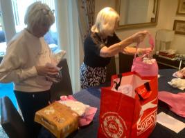 Preparing the bags for the babies and mothers.