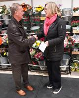 Malcolm Huckerby presents the prize of a £250 Waitrose voucher to lucky winner Alison Christopher