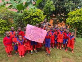 Children at the Small Steps Foundation school in Uganda thank Rotary Club of Farnham for providing funds for their uniforms.