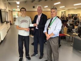 Tali receiving cheque from Clive Bath with Adam Teasdale attending. 29/9/2026