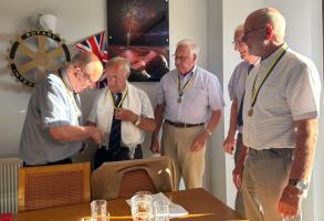 IPP Tony, supported by the other three Presidents for 2025/26, congratulates Peter on becoming President.