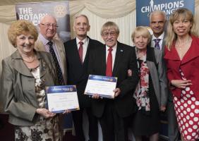 Janet and David displaying their awards