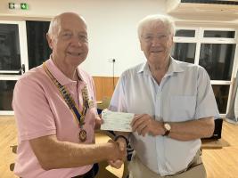 Graham hands £590 cheque donation over to President Anton
