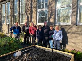 Club members by one of the planters