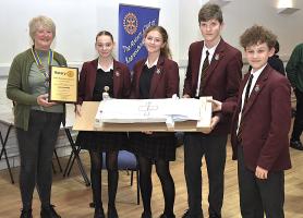 Photograph shows Knaresborough President Deborah Wilson presenting the Foundation Gold Winners award to the team from Ashville College.