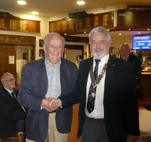 President Mike congratulating John Lavin(golf)