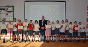 Rotary of Teignmouth’s President Mike Waters with contestants of the 2025 Junior Speaks. 