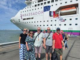Members of Braintree Rivers in Honfleur, France standing in front of the cruise ship Ambience.