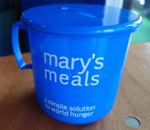 A cup-shaped collection box for Mary's Meals
