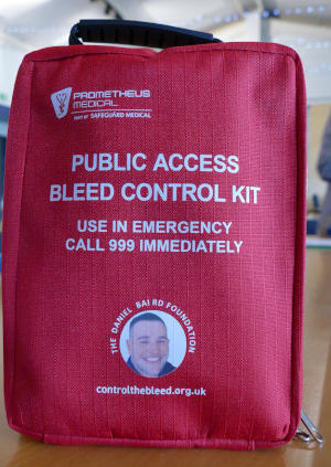 A red bag bearing the words 'Public access bleed control kit' in white