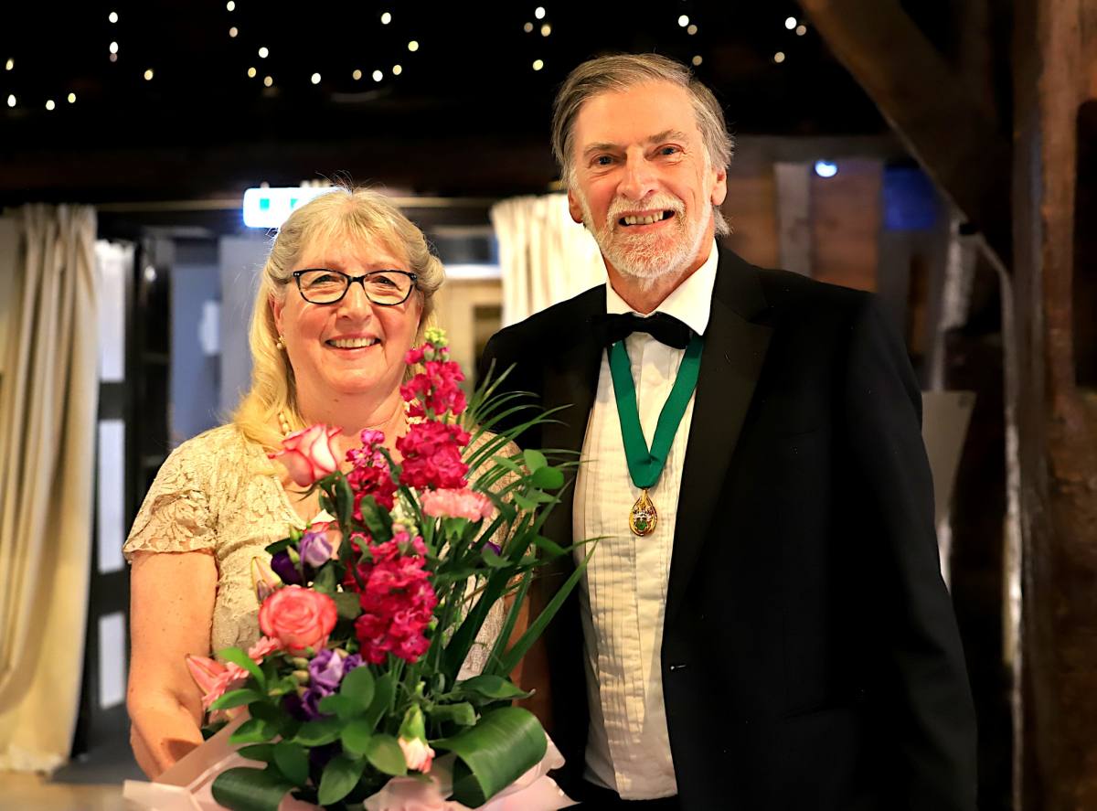 Rotarian Gordon Stone and wife Julie after Mayor of Horwich presented bouquet to celebrate Golden Wedding